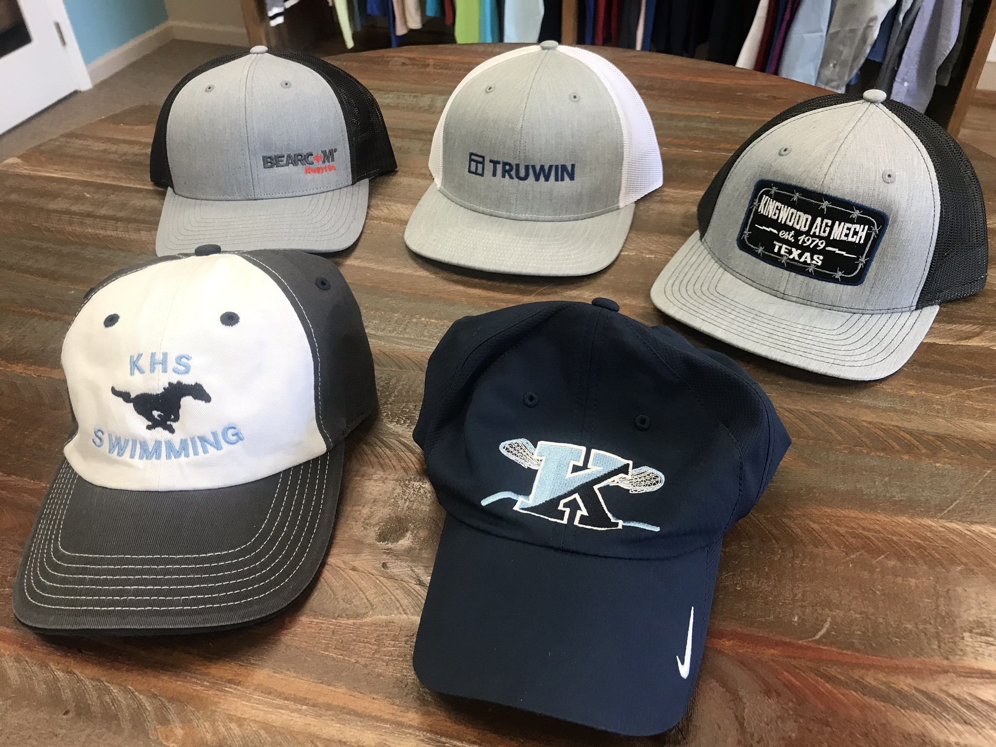 Logo embroidered caps by K&S Sportswear.
